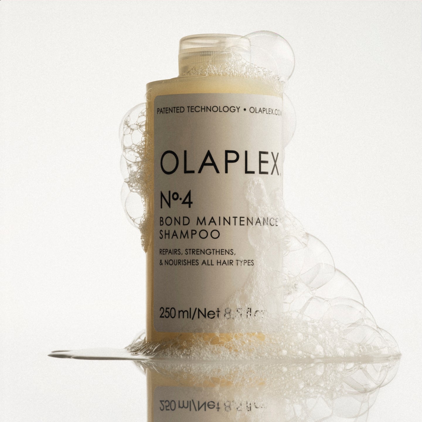 Nᴼ.4 Bond Maintenance® Shampoo surrounded by bubbles