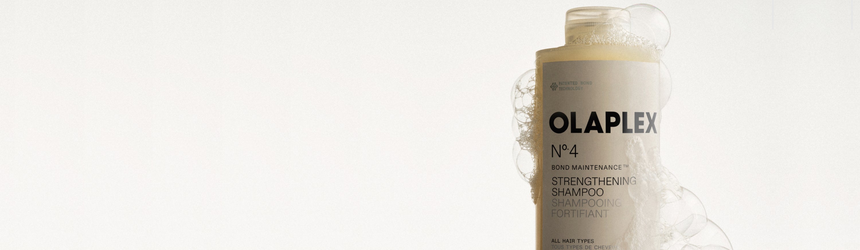 Bottle of shampoo with suds