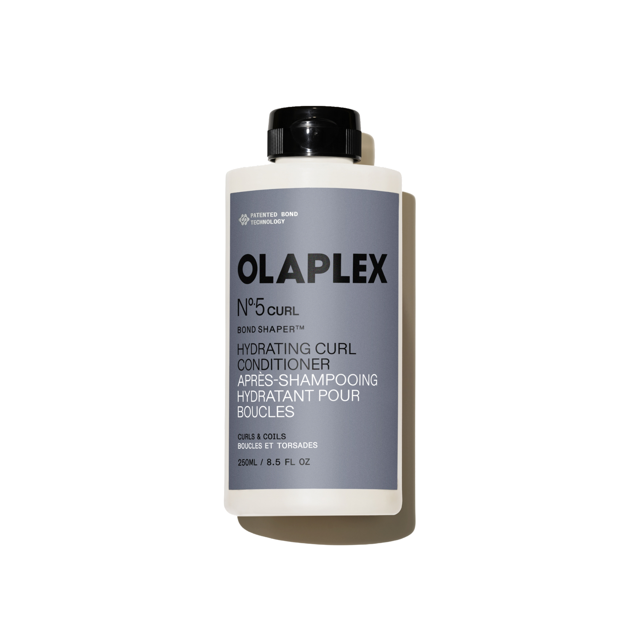 Bouteille de l'Olaplex N°.5CURL Bond Shaper Hydrating Curl Conditioner 250 ml sur fond blanc uni.