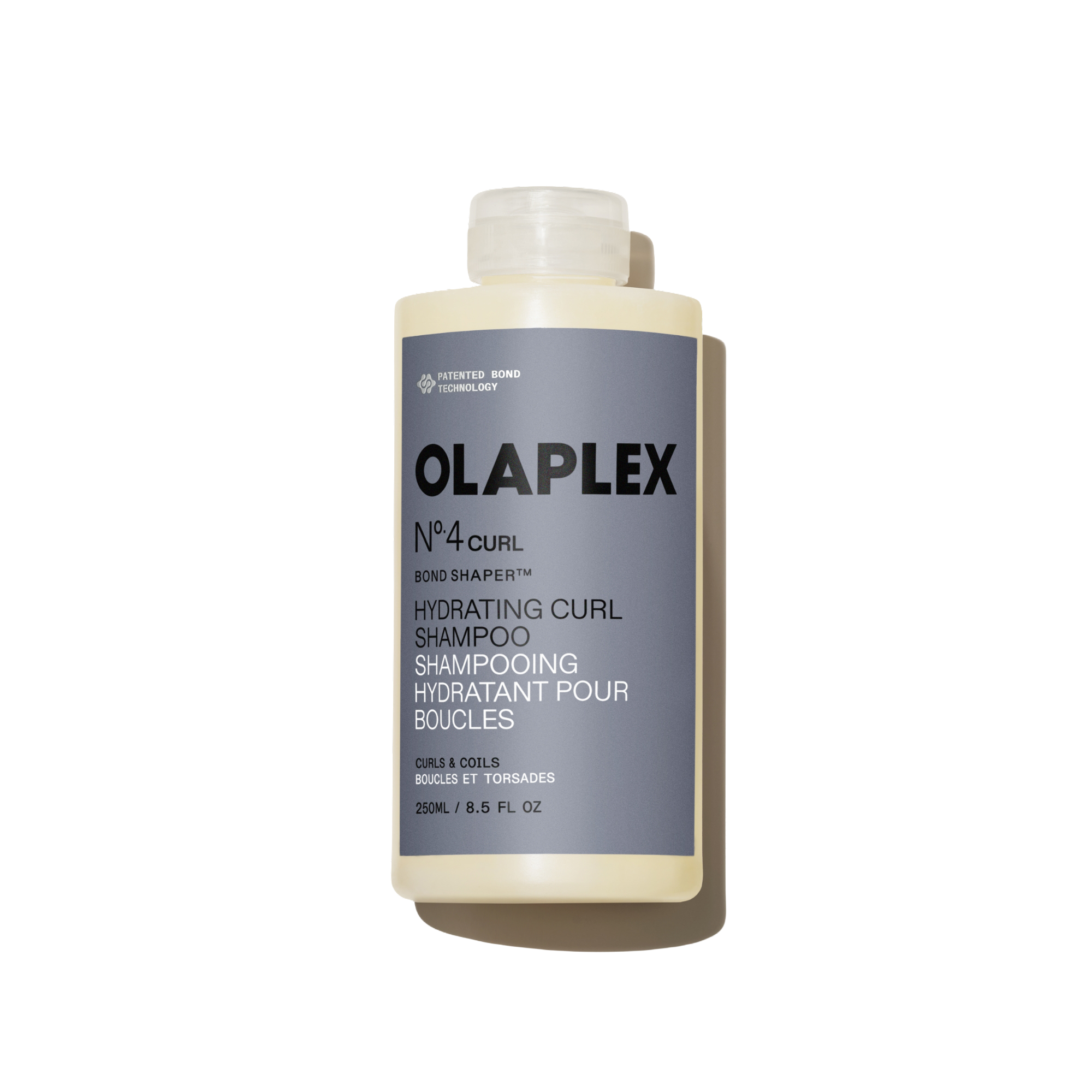 Bouteille de l'Olaplex N°.4CURL Bond Shaper Hydrating Curl Shampoo 250 ml sur fond blanc uni