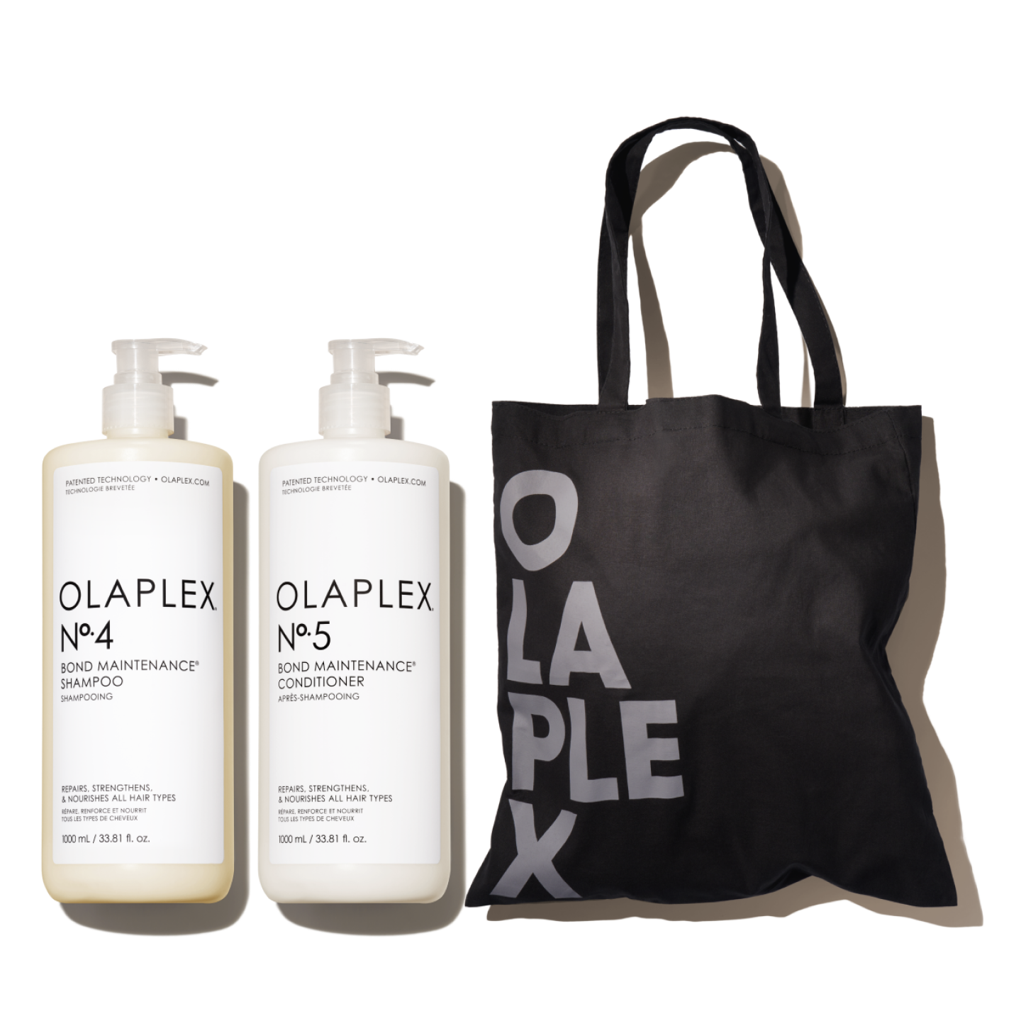 Left Bottle (Nº.4):

OLAPLEX
Nº.4 BOND MAINTENANCE SHAMPOO
1000 mL / 33.8 fl.oz.

Right Bottle (Nº.5):
OLAPLEX
Nº.5 BOND MAINTENANCE CONDITIONER
1000 mL / 33.8 fl.oz.

Tote Bag: Has a large "OLAPLEX" logo printed on it.